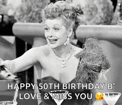 A Black And White Photo Of A Woman Sitting At A Table With A Martini And A Birthday Message . GIF