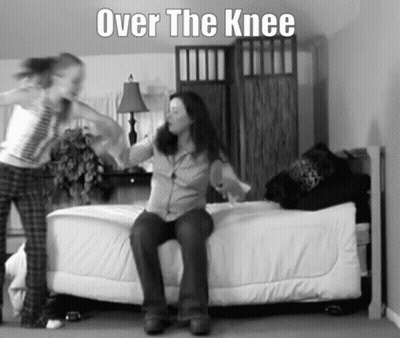 A Black And White Photo Of A Woman Sitting On A Bed With The Words Over The Knee Above Her GIF