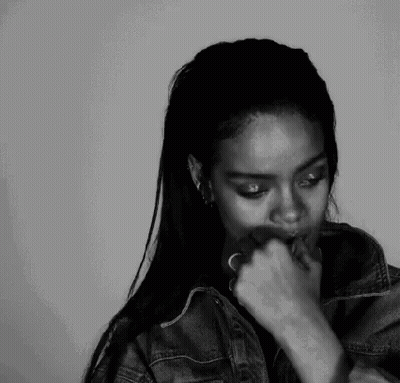 A Black And White Photo Of A Woman Smoking A Cigarette . GIF