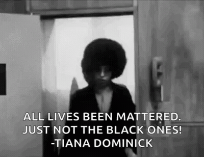 A Black And White Photo Of A Woman Standing In Front Of A Door With A Quote . GIF