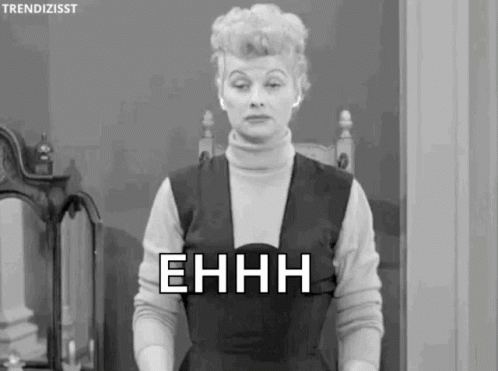 A Black And White Photo Of A Woman Standing In Front Of A Mirror With The Words Ehhh Written On Her Face . GIF