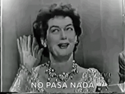 A Black And White Photo Of A Woman Waving Her Hand In A Foreign Language . GIF