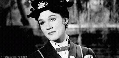 A Black And White Photo Of A Woman Wearing A Hat And Tie . GIF