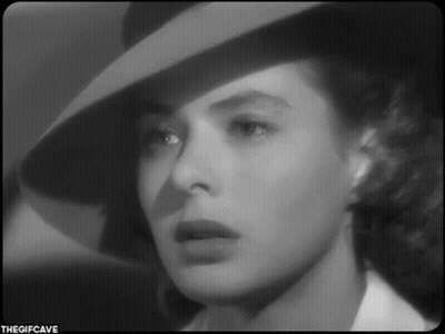A Black And White Photo Of A Woman Wearing A Hat With The Gifcave Written On The Bottom GIF