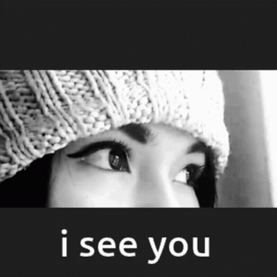 A Black And White Photo Of A Woman Wearing A Knitted Hat And The Words I See You Below Her GIF
