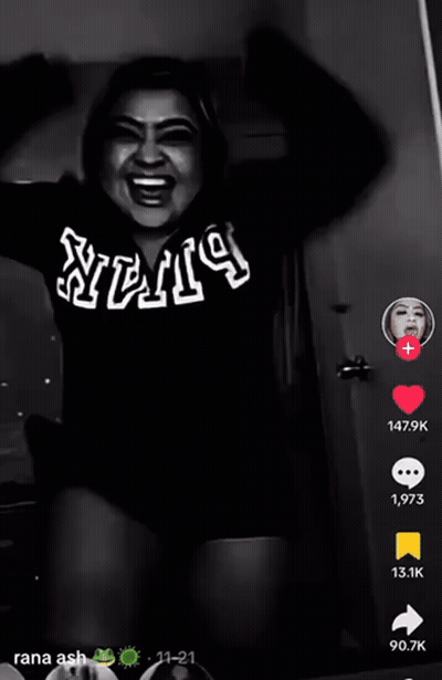 A Black And White Photo Of A Woman Wearing A Shirt That Says ' Stv ' On It GIF