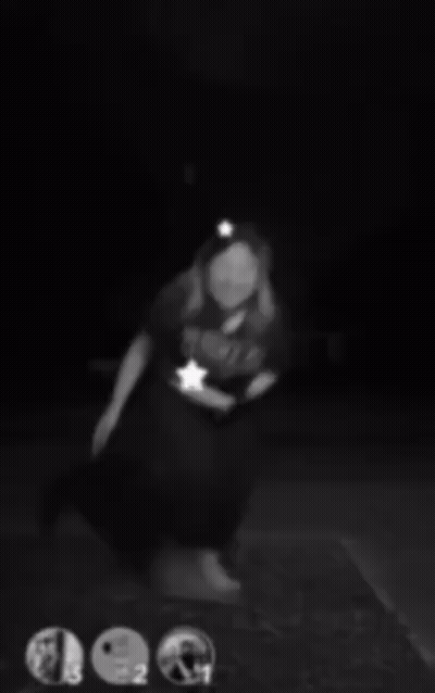 A Black And White Photo Of A Woman Wearing Headphones And A Headband . GIF