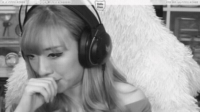 A Black And White Photo Of A Woman Wearing Headphones With The Words Stella Chuu On The Bottom Right GIF