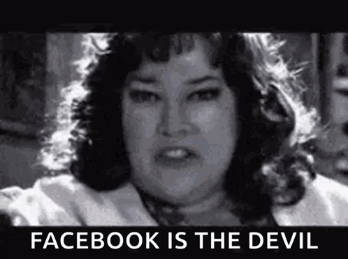 A Black And White Photo Of A Woman With A Caption That Says `` Facebook Is The Devil '' . GIF