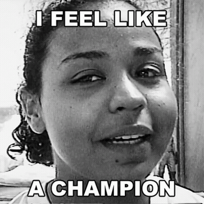 A Black And White Photo Of A Woman With A Caption That Says " I Feel Like A Champion " GIF