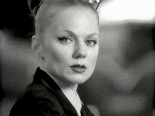 A Black And White Photo Of A Woman With A Cat Ear GIF