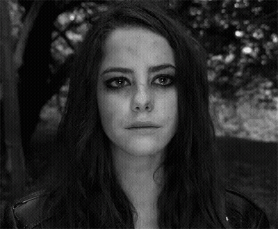 A Black And White Photo Of A Woman With A Crying Face . GIF
