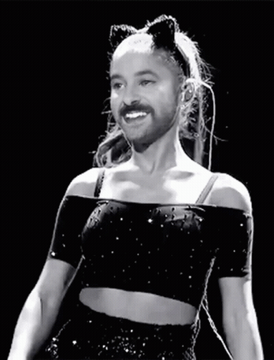 A Black And White Photo Of A Woman With A Fake Beard And Cat Ears . GIF