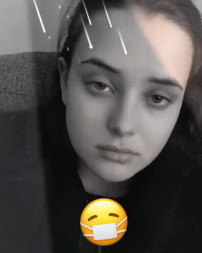 A Black And White Photo Of A Woman With A Mask On GIF