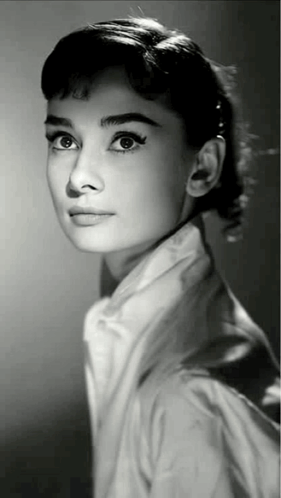 a black and white photo of a woman with a ponytail