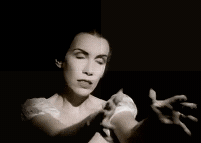 A Black And White Photo Of A Woman With A Surprised Expression On Her Face . GIF