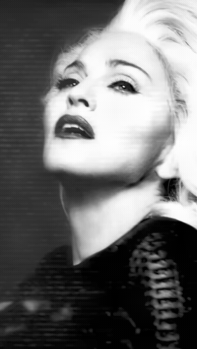 A Black And White Photo Of A Woman With Blonde Hair And Red Lips . GIF