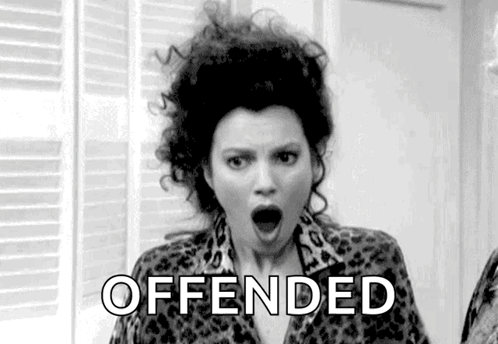 A Black And White Photo Of A Woman With Her Mouth Open And The Word Offended Written On Her Face . GIF