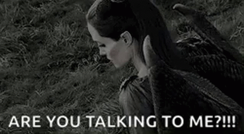 A Black And White Photo Of A Woman With Horns And The Words `` Are You Talking To Me '' . GIF