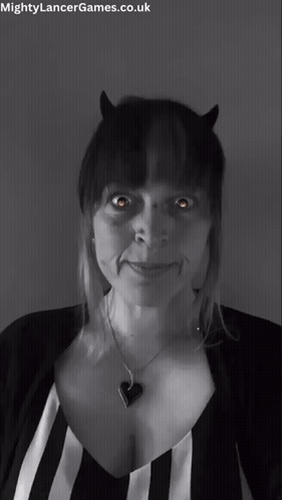 A Black And White Photo Of A Woman With Horns And The Words Mightylancergames.co.uk At The Bottom GIF