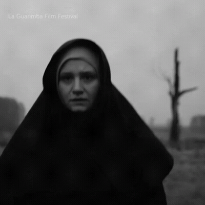 A Black And White Photo Of A Woman With La Guarimba Film Festival Written On The Bottom GIF
