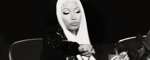 A Black And White Photo Of A Woman With Long Blonde Hair . GIF