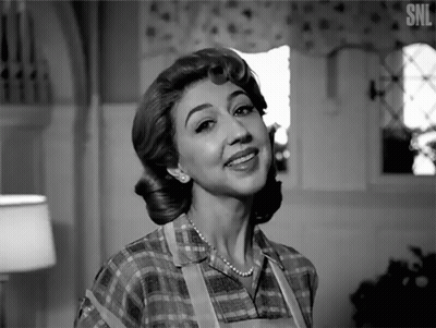 A Black And White Photo Of A Woman With The Letters Snl On The Bottom Right GIF