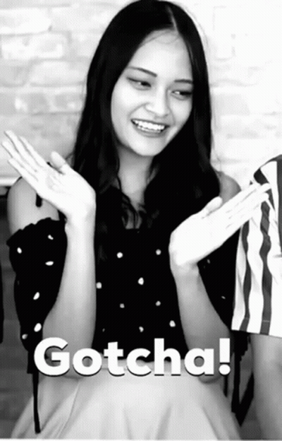 A Black And White Photo Of A Woman With The Word Gotcha Written On The Bottom GIF