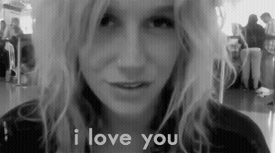 A Black And White Photo Of A Woman With The Words I Love You Behind Her GIF