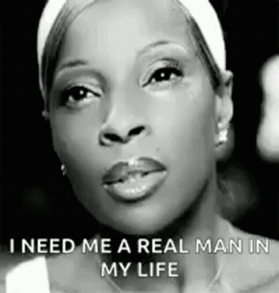 A Black And White Photo Of A Woman With The Words `` I Need Me A Real Man In My Life '' Written On Her Face . GIF