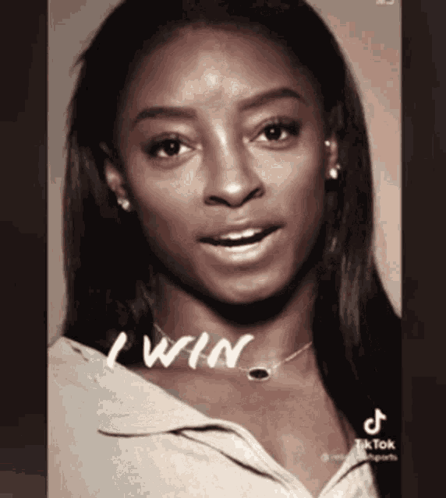 A Black And White Photo Of A Woman With The Words " I Win " On Her Neck GIF