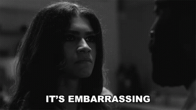 A Black And White Photo Of A Woman With The Words " It 'S Embarrassing " Below Her GIF