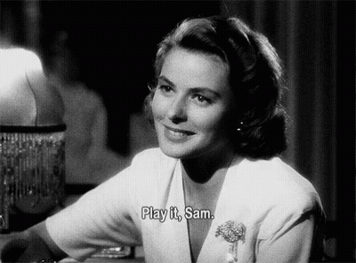 A Black And White Photo Of A Woman With The Words Play It Sam Above Her GIF