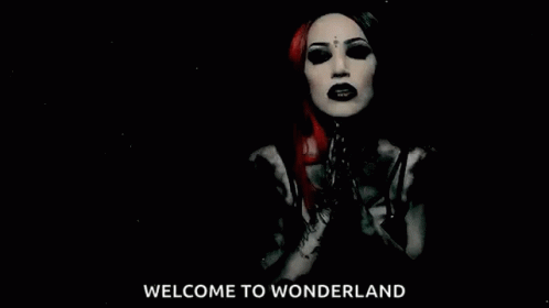 A Black And White Photo Of A Woman With The Words Welcome To Wonderland Behind Her GIF