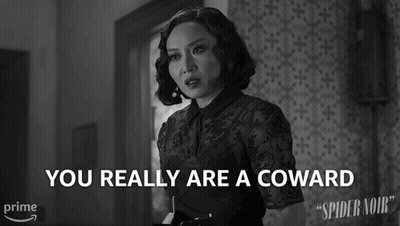 A Black And White Photo Of A Woman With The Words " You Really Are A Coward " Above Her GIF