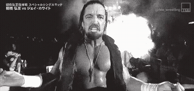 A Black And White Photo Of A Wrestler With Foreign Writing On The Bottom GIF
