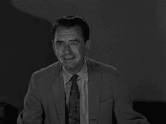 A Black And White Photo Of A Young Boy GIF