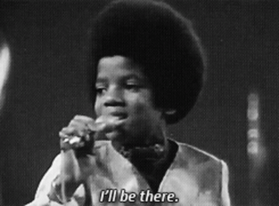 A Black And White Photo Of A Young Boy Singing Into A Microphone And Saying I 'Ll Be There GIF