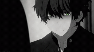 A Black And White Photo Of A Young Boy With Green Eyes GIF