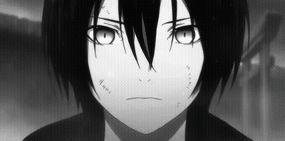 A Black And White Photo Of A Young Boy With Long Black Hair And Big Eyes . GIF