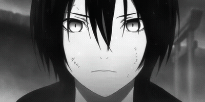 A Black And White Photo Of A Young Boy With Long Black Hair And Big Eyes . GIF