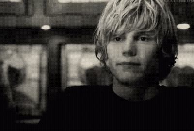 A Black And White Photo Of A Young Man 'S Face GIF