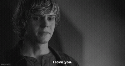 A Black And White Photo Of A Young Man Saying " I Love You " GIF