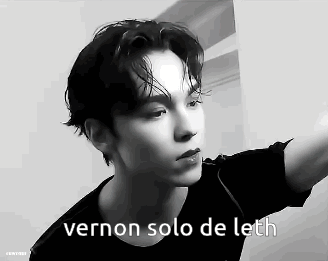 A Black And White Photo Of A Young Man With The Words `` Vernon Solo De Leth '' Written On It . GIF