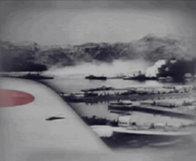 A Black And White Photo Of An Airplane Wing With A Red Circle On It GIF