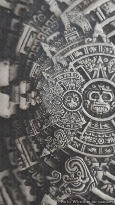 A Black And White Photo Of An Ancient Mexican Calendar . GIF
