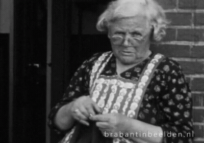 A Black And White Photo Of An Elderly Woman Knitting With Brabantinbeelden.nl Written On The Bottom GIF