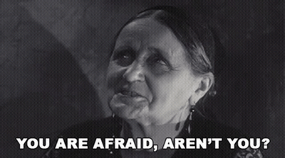 A Black And White Photo Of An Elderly Woman Saying You Are Afraid Aren 'T You GIF