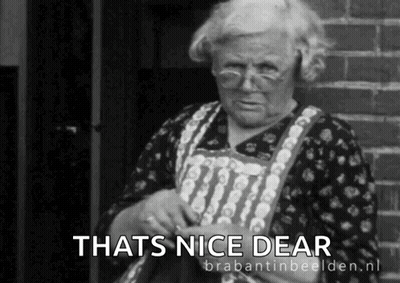 a black and white photo of an elderly woman with the caption that 's nice dear '