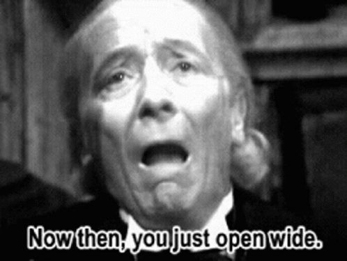 A Black And White Photo Of An Older Man With The Words Now Then You Just Open Wide GIF